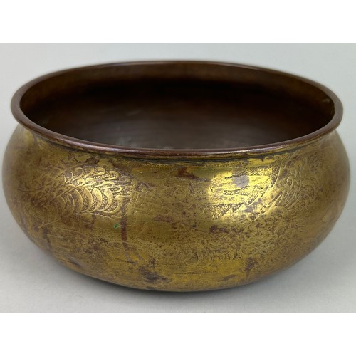 21 - A LARGE GILT COPPER BOWL DECORATED WITH A LARGE DRAGON ON TRIPOD FEET, 

16cm x 7cm