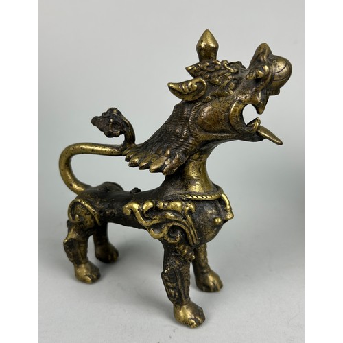 12 - A 19TH CENTURY GILT BRONZE FIGURE OF A LION,

15cm x 13cm