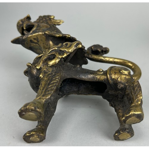 12 - A 19TH CENTURY GILT BRONZE FIGURE OF A LION,

15cm x 13cm