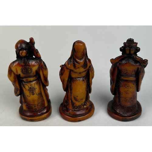 109 - THREE CHINESE RESIN FIGURES, 

Tallest 7cm H