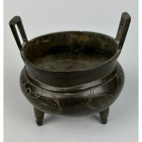 6 - A CHINESE BRONZE CENSER ON TRIPOD FEET WITH SIX CHARACTER MARK TO VERSO, 

9cm x 9cm