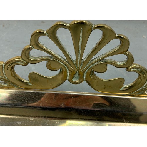 533 - AN EARLY 20TH CENTURY BRASS FIRE FENDER, 

135cm x 35cm x 28cm