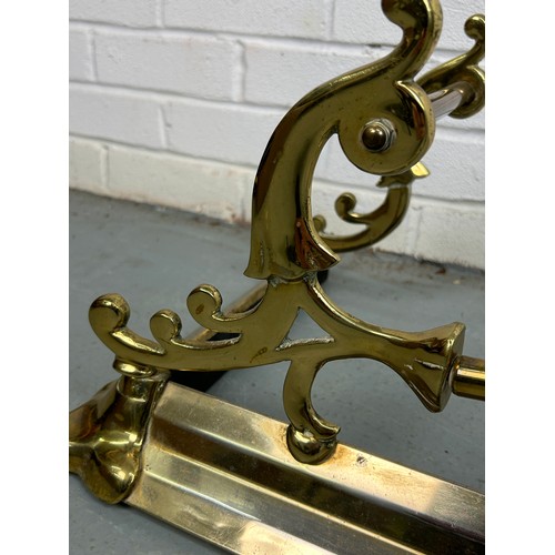 533 - AN EARLY 20TH CENTURY BRASS FIRE FENDER, 

135cm x 35cm x 28cm