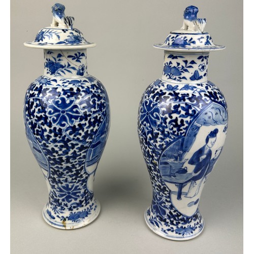 55 - A PAIR OF 19TH CENTURY CHINESE BLUE AND WHITE PORCEALIN VASES WITH LIDS,

Decorated with figures and... 