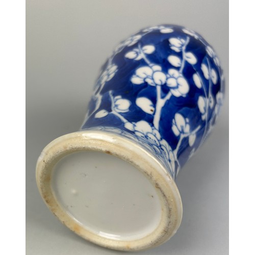 57 - AN EARLY 19TH CENTURY CHINESE BLUE AND WHITE PORCELAIN VASE DECORATED WITH PRUNUS FLOWERS,

22cm H