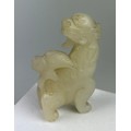 AN EARLY 19TH CENTURY CHINESE WHITE JADE GROUP OF A LION,

7.5cm x 4.7cm x 1.8cm