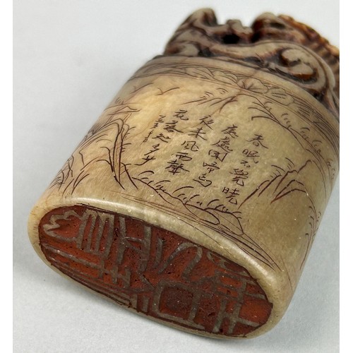 107 - A 19TH CENTURY CHINESE SOAPSTONME SEAL WITH A LION AND CALLIGRAPHY,

7.5cm x 4.5cm x 2.3cm