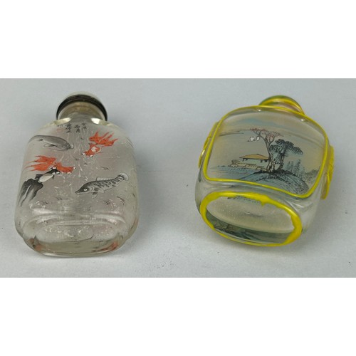 108 - TWO GLASS SNUFF BOTTLES DECORATED WITH FISH AND LANDSCAPE SCENES,

Each 7cm H