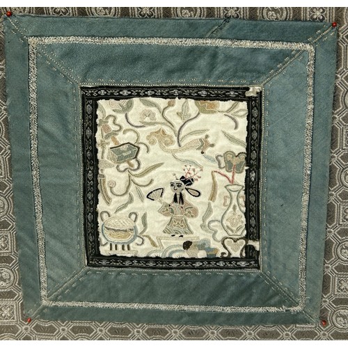 97 - A 19TH CENTURY SMALL CHINESE SILK PANEL DEPICTING A FIGURE,

12cm x 10cm. Mounted in two silk mounts... 