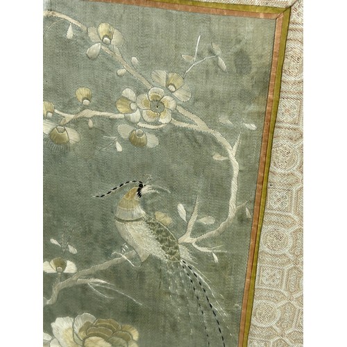 99 - AN EARLY 19TH CENTURY CHINESE SILK PANEL DEPICTING FLOWERS AND BIRDS,

51cm x 14cm. In silk border, ... 