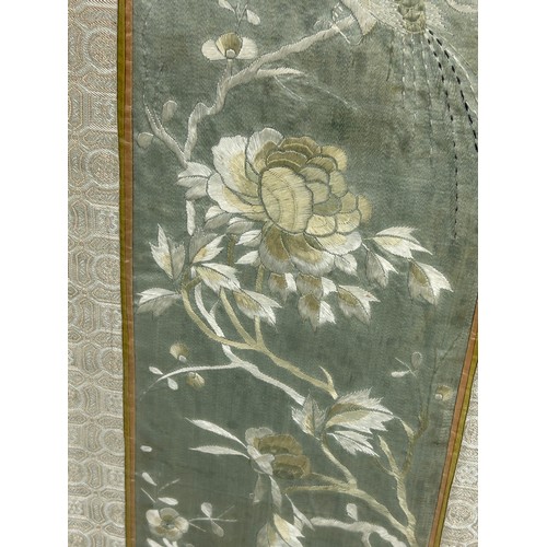 99 - AN EARLY 19TH CENTURY CHINESE SILK PANEL DEPICTING FLOWERS AND BIRDS,

51cm x 14cm. In silk border, ... 