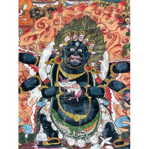 100 - A 19TH CENTURY TIBETAN PAINTED SILK SCROLL WALL HANGING, 

46cm x 34cm 

With silk border 86cm x 60c... 