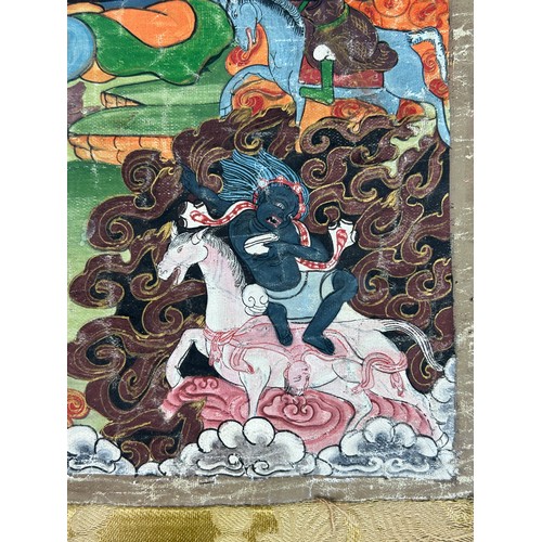 100 - A 19TH CENTURY TIBETAN PAINTED SILK SCROLL WALL HANGING, 

46cm x 34cm 

With silk border 86cm x 60c... 