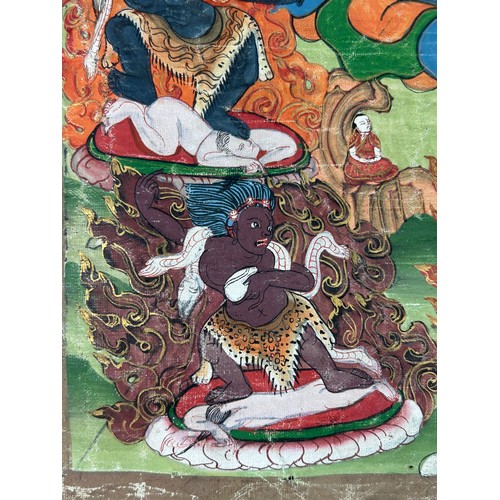 100 - A 19TH CENTURY TIBETAN PAINTED SILK SCROLL WALL HANGING, 

46cm x 34cm 

With silk border 86cm x 60c... 