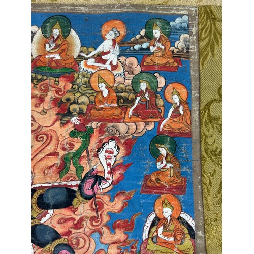 100 - A 19TH CENTURY TIBETAN PAINTED SILK SCROLL WALL HANGING, 

46cm x 34cm 

With silk border 86cm x 60c... 