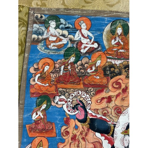 100 - A 19TH CENTURY TIBETAN PAINTED SILK SCROLL WALL HANGING, 

46cm x 34cm 

With silk border 86cm x 60c... 