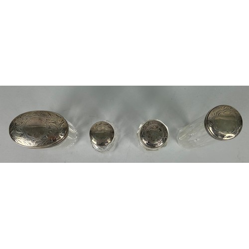 158 - FOUR GLASS BOTTLES WITH SILVER TOPS (4)