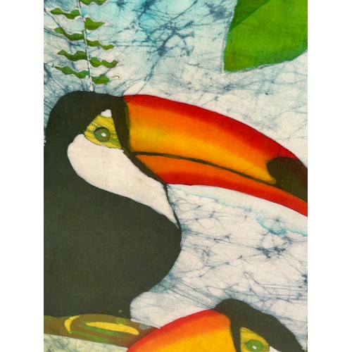 448 - A LARGE PAINTING ON LINEN DEPICTING TWO TOUCANS IN A TREE, 

75cm x 54cm.

Mounted in a frame and gl... 