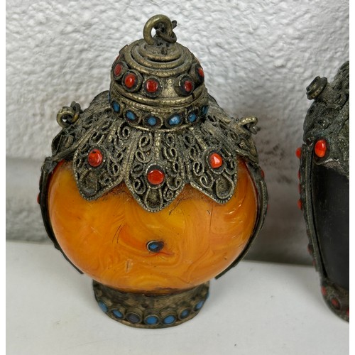 108A - A GROUP OF THREE SNUFF BOTTLES DECORATED WITH RED AND BLUE CABOCHONS (3) 

One amber coloured. All w... 