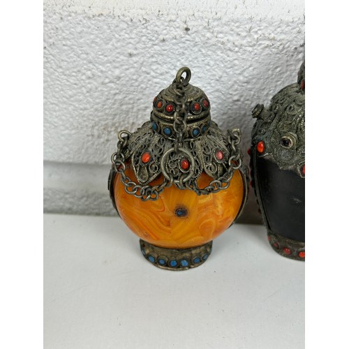 108A - A GROUP OF THREE SNUFF BOTTLES DECORATED WITH RED AND BLUE CABOCHONS (3) 

One amber coloured. All w... 