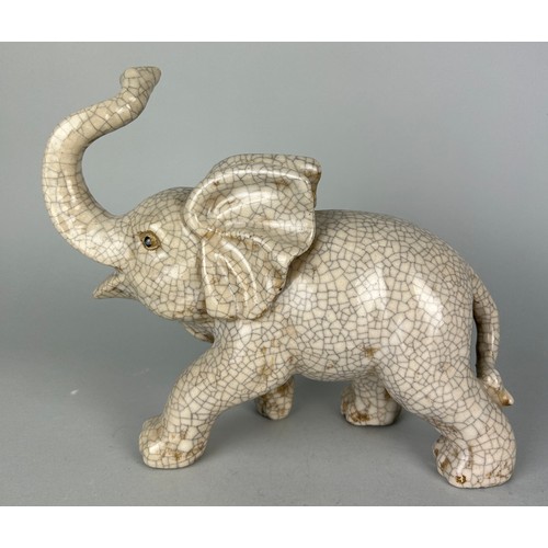 114D - A CHINESE CRACKLE GLAZED ELEPHANT, 

24cm x 20cm