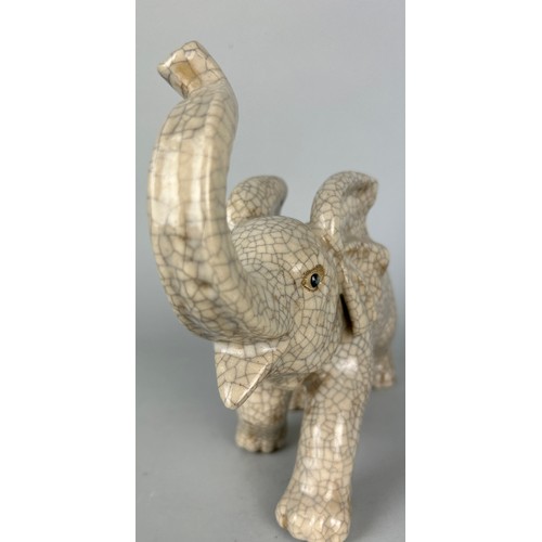 114D - A CHINESE CRACKLE GLAZED ELEPHANT, 

24cm x 20cm