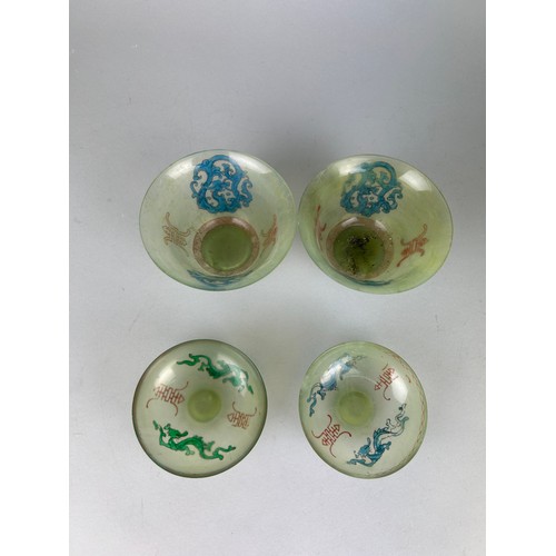 114H - A PAIR OF JADE TEA CUPS AND COVERS,

10cm x 6cm each.