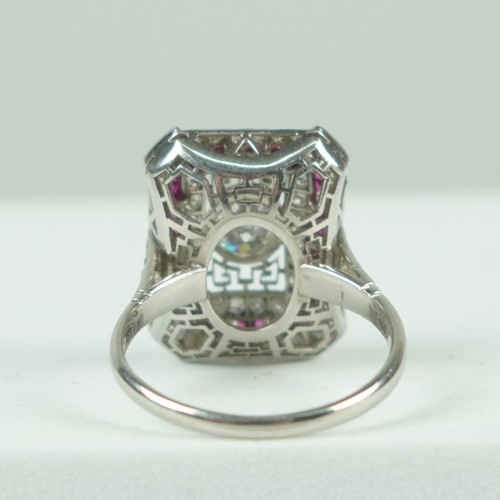 188A - A RING SET WITH CENTRAL DIAMOND SURROUNDED BY RUBIES AND DIAMONDS,

Weight 6.4gms

Marked LF possibl... 