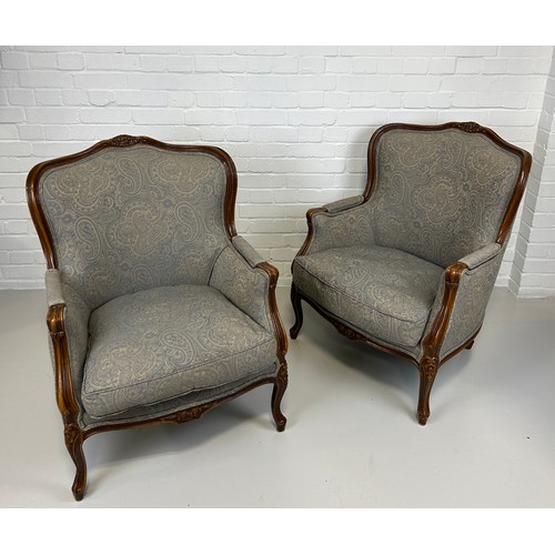 447 - A PAIR OF FRENCH WALNUT BERGERE ARMCHAIRS UPHOLSTERED IN GREY PAISLEY FABRIC, 

91cm x 74cm x 68cm e... 