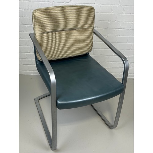 463 - A ROLF BENZ ARMCHAIR, 

Chrome frame and blue leather seat with cream upholstered back cushion.

85c... 