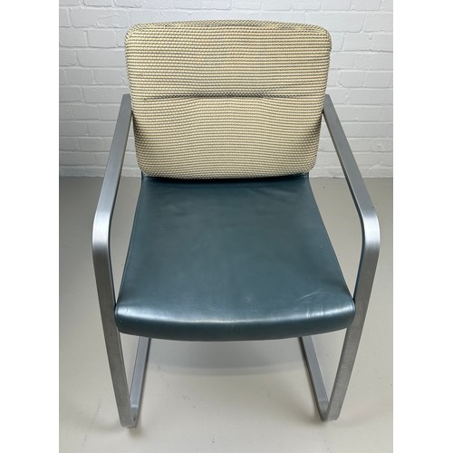 463 - A ROLF BENZ ARMCHAIR, 

Chrome frame and blue leather seat with cream upholstered back cushion.

85c... 