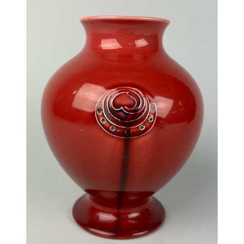 279A - WILLIAM MOORCROFT (1872-1945): A RED FLAMMINIAN WARE VASE MADE FOR LIBERTY AND CO, 

17cm in height.