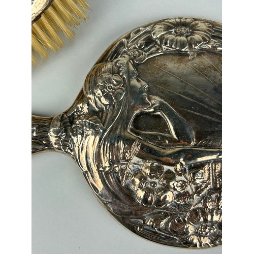 300 - AN ART NOUVEAU SILVER VANITY SET (4) 

To include two mirrors and two brushes.