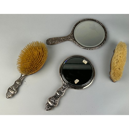 300 - AN ART NOUVEAU SILVER VANITY SET (4) 

To include two mirrors and two brushes.