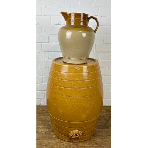 282 - A LARGE CERAMIC BARREL AND RELATED JUG (2)