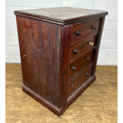 410 - A 19TH CENTURY MAHOGANY MINIATURE WELLINGTON CABINET OR COLLECTORS CABINET WITH FOUR DRAWERS