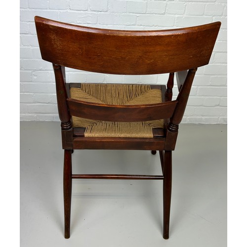 441 - AN EARLY 20TH CENTURY ARMCHAIR OR DESK CHAIR, 

Flame mahogany with scroll arms and cane upholstered... 