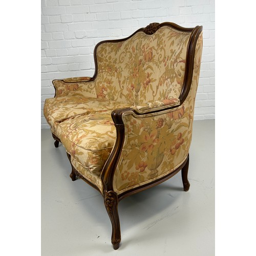 448 - A LARGE FRENCH WALNUT TWO SEATER SOFA OR CANAPE UPHOLSTERED IN FLORAL FABRIC,

128cm x 94cm x 77cm