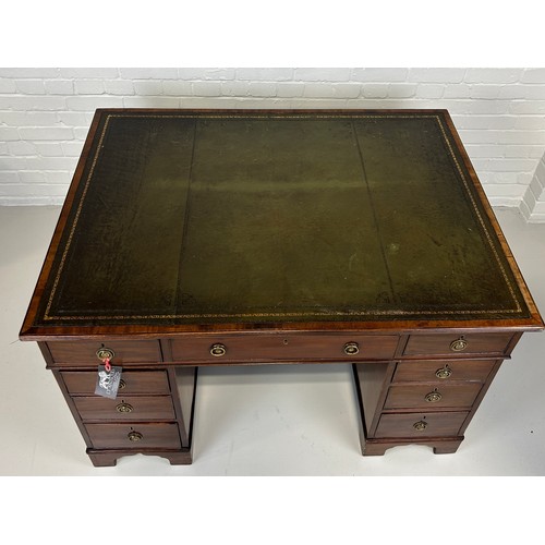 440 - AN EARLY 19TH CENTRAL PARTNERS DESK, 

Two pedestals, each with ten drawers with brass handles. Gree... 