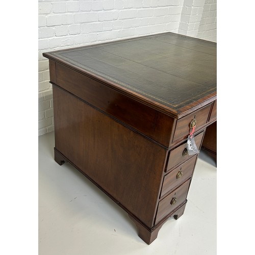 440 - AN EARLY 19TH CENTRAL PARTNERS DESK, 

Two pedestals, each with ten drawers with brass handles. Gree... 