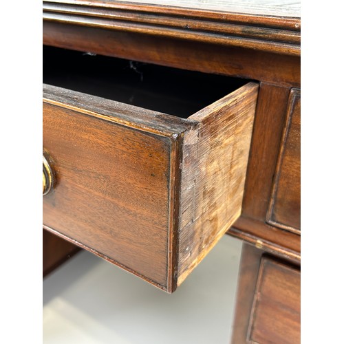 440 - AN EARLY 19TH CENTRAL PARTNERS DESK, 

Two pedestals, each with ten drawers with brass handles. Gree... 