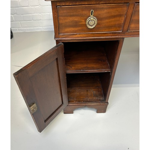 440 - AN EARLY 19TH CENTRAL PARTNERS DESK, 

Two pedestals, each with ten drawers with brass handles. Gree... 