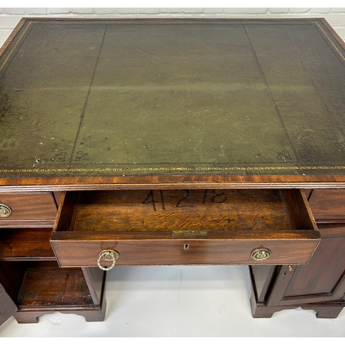 440 - AN EARLY 19TH CENTRAL PARTNERS DESK, 

Two pedestals, each with ten drawers with brass handles. Gree... 