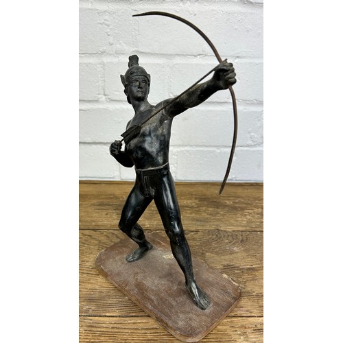 245 - A CAST METAL SCULPTURE OF AN ARCHER WITH BOW AND ARROW, 

On wooden stand. 

27cm H