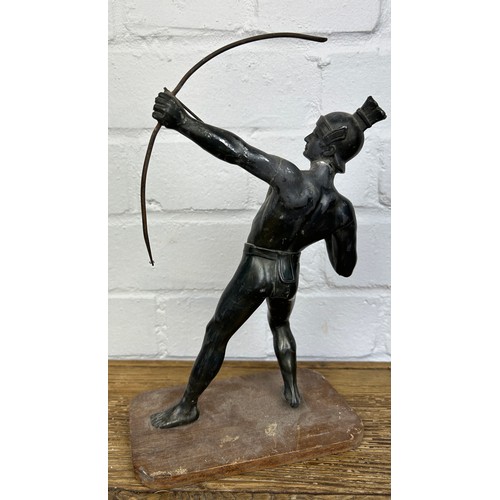 245 - A CAST METAL SCULPTURE OF AN ARCHER WITH BOW AND ARROW, 

On wooden stand. 

27cm H