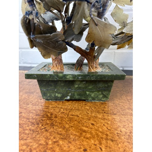 222 - A PAIR OF CHINESE HARD STONE PLANTERS WITH FLOWERS (2) 

44cm H x 37cm L x 25cm W