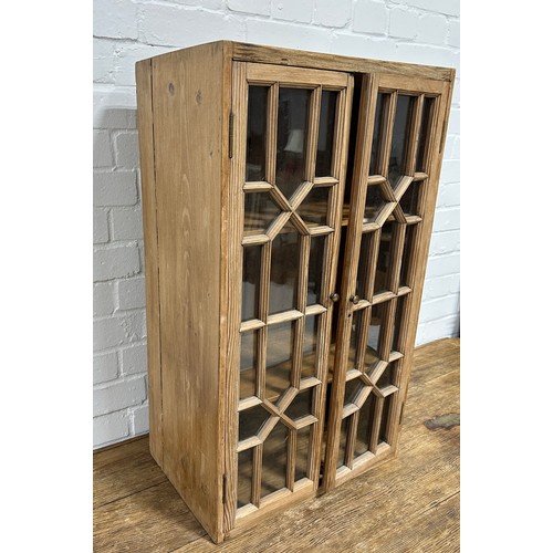 419 - A PINE CABINET WITH 'CRISS CROSS' GLAZED DOORS,

76cm x 46cm x 29cm