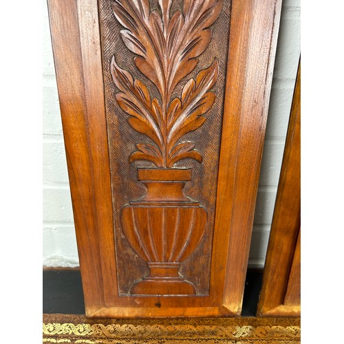 550 - A PAIR OF DECORATIVE WOODEN PANELS WITH CARVED URNS AND FLOWERS (2), 

67cm x 22cm