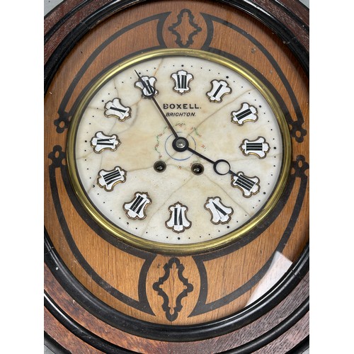 571 - A CASED CLOCK BY BOXELL BRIGHTON WITH MARBLE FACE AND PORCELAIN NUMERALS

56cm x 48cm x 12cm