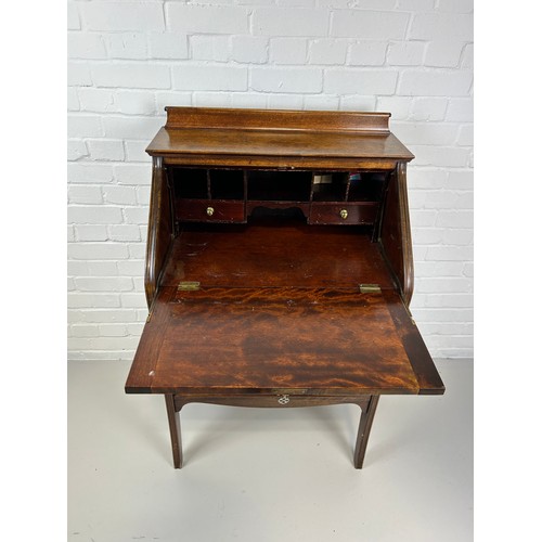 530 - AN OAK 'GREEN MAN' BUREAU, 

Drop front over three drawers. 

111cm H x 68cm W x 44cm D